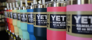 A variety of Yeti cups on a shelf