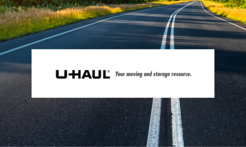 A paved road with a Uhaul logo posted over it