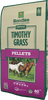 Bag of Standlee Timothy Grass Pellets with horses on a green and purple background
