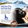 Dog with a treat in front of a scenic mountain landscape, promoting Smart Cookie Barkery products.