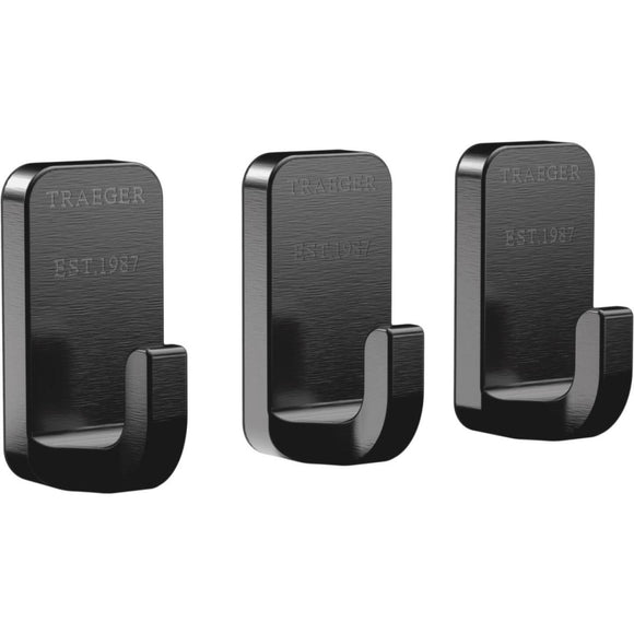 Three black Traeger hooks on a white background