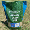 Bag of premium quality grass seed with a blue and green design on a grassy background