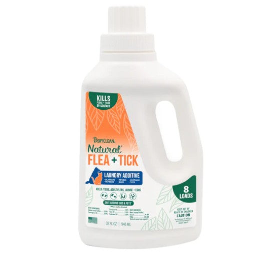 Bottle of TropiClean Natural Flea + Tick laundry additive on a white background